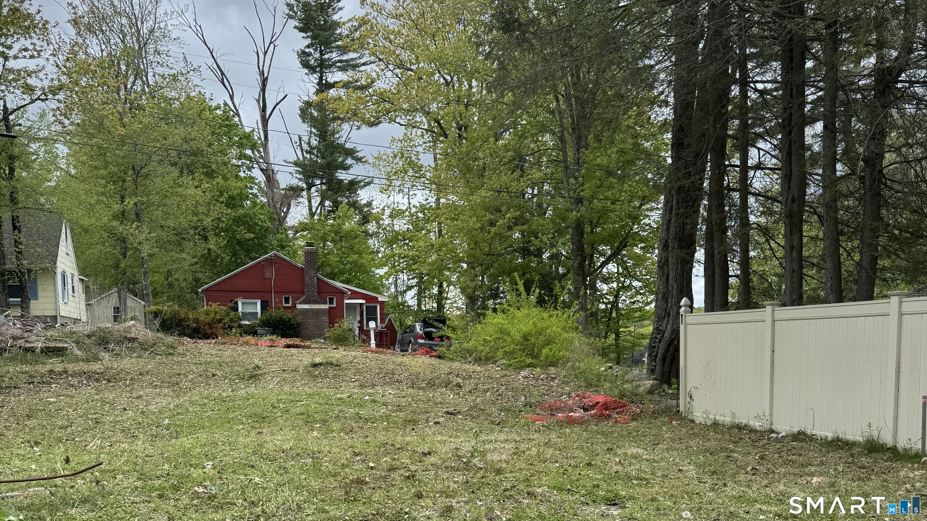 12 Hilltop Road New Hartford, CT 06057 - Photo 4 of 4 a backyard of a house with table and chairs