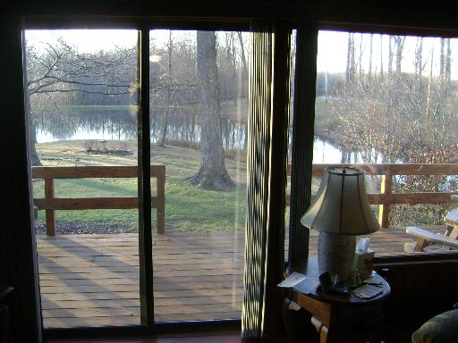 7872 Baylis Road Kinmundy, IL 62854 - Photo 5 of 16 a view of a glass door and a floor to ceiling window