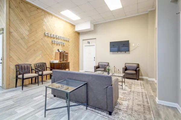 a living room with furniture and a flat screen tv