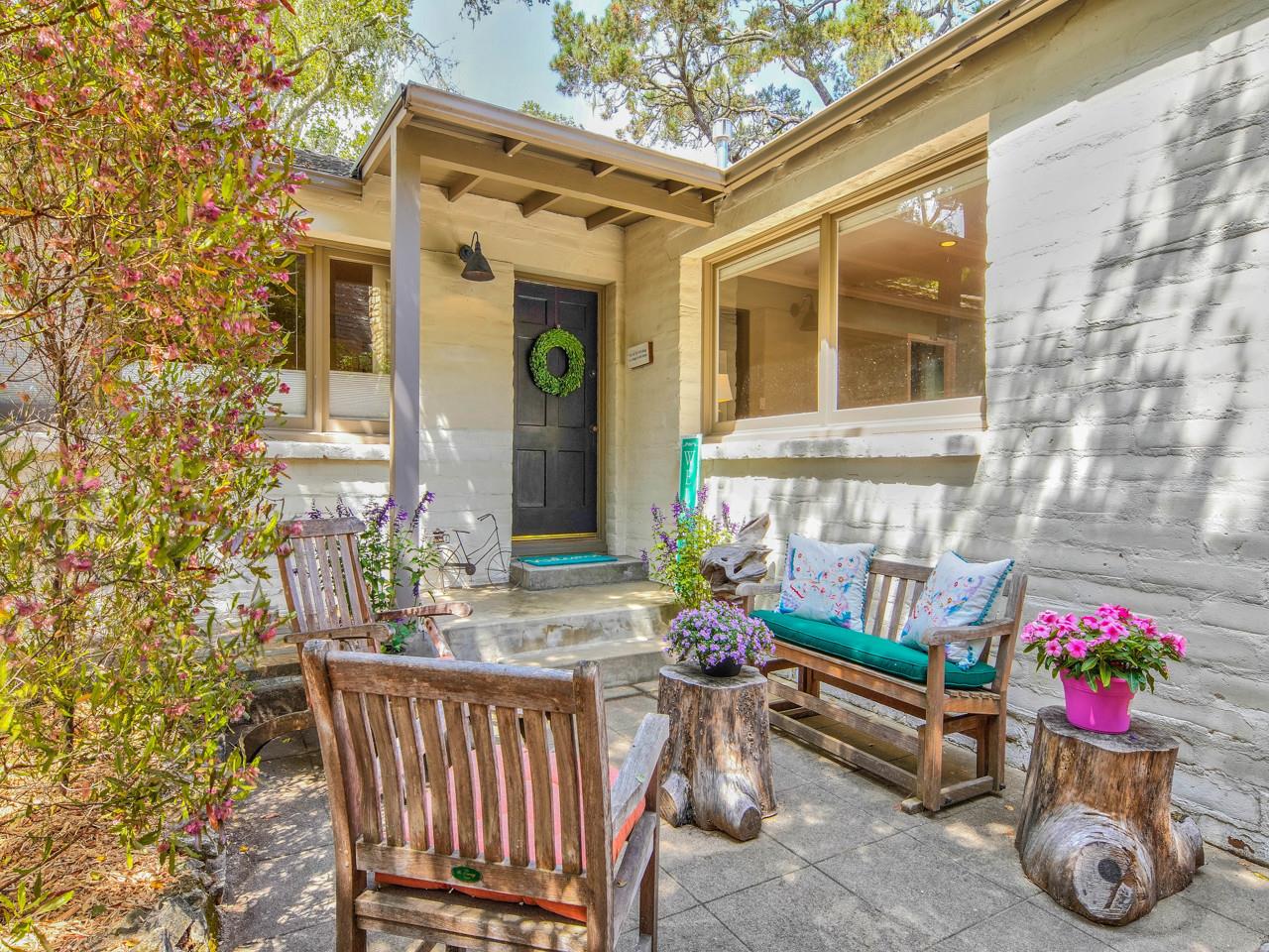 a view of front door of house with seating space