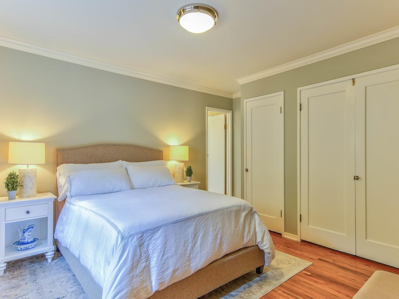 3 11th Avenue Carmel, CA 93923 - Photo 19 of 26 a bedroom with a bed and a lamp