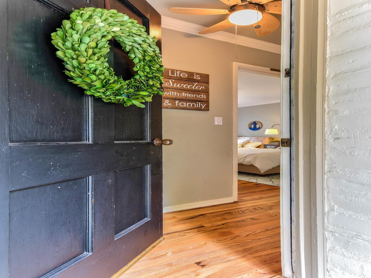 3 11th Avenue Carmel, CA 93923 - Photo 2 of 26 a potted plant sitting in front of a door