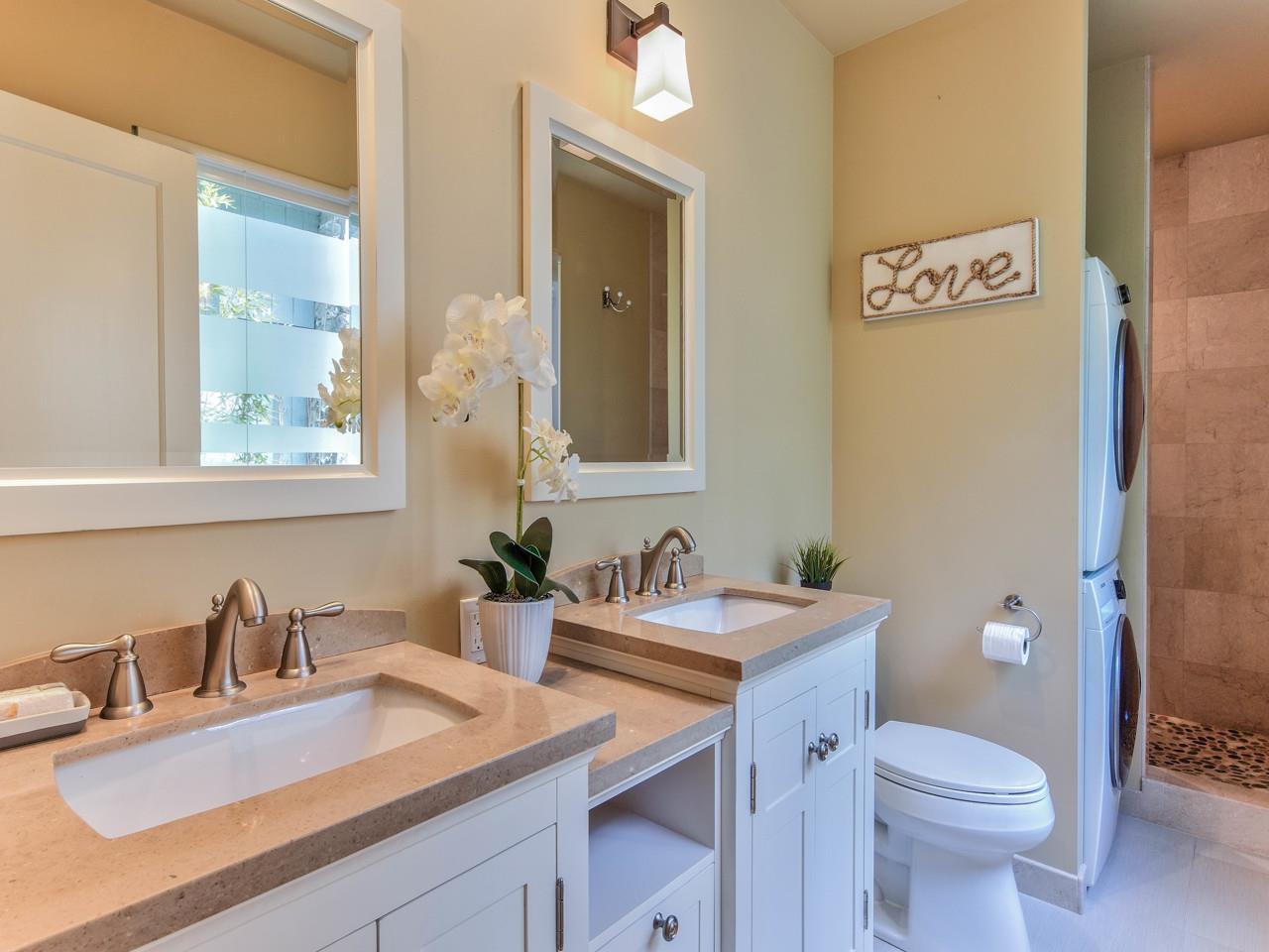 3 11th Avenue Carmel, CA 93923 - Photo 21 of 26 a bathroom with a granite countertop sink mirror vanity and toilet