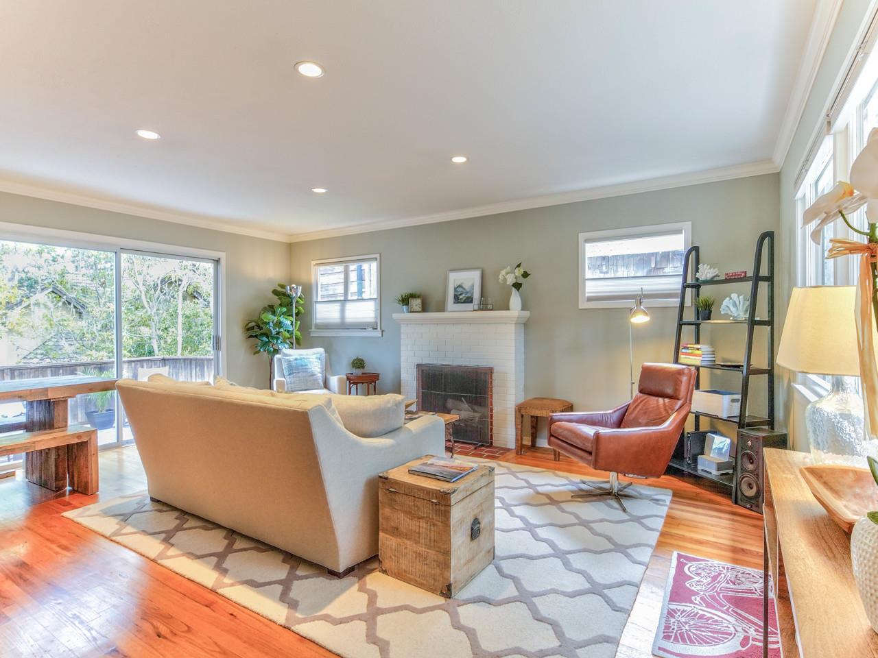 3 11th Avenue Carmel, CA 93923 - Photo 5 of 26 a living room with fireplace furniture and a large window
