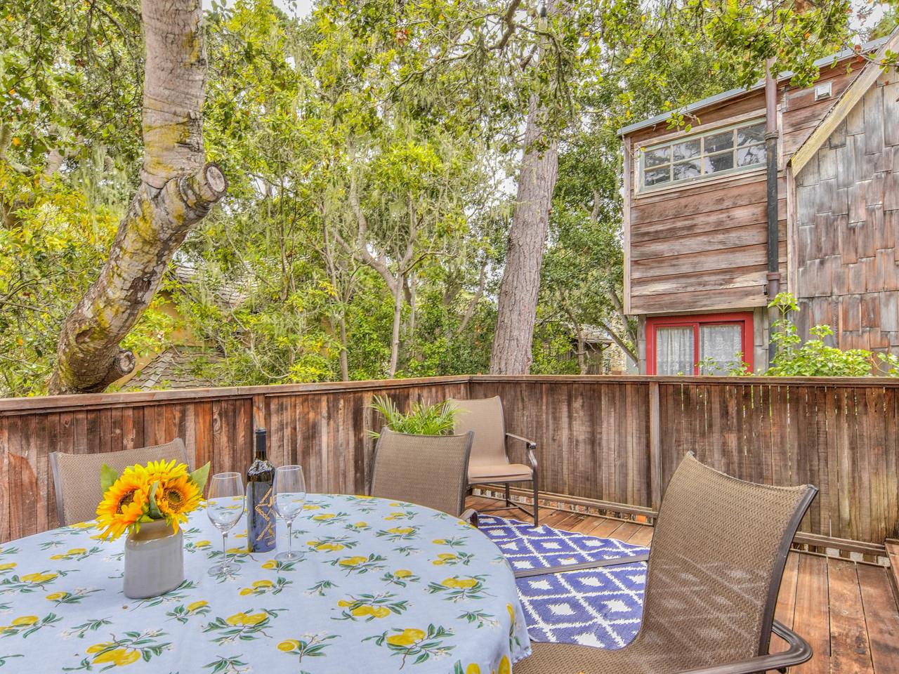 3 11th Avenue Carmel, CA 93923 - Photo 8 of 26 a view of a chair and tables in the roof deck