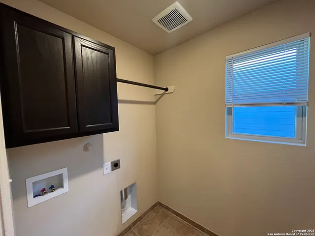 a bathroom with a shower and a microwave