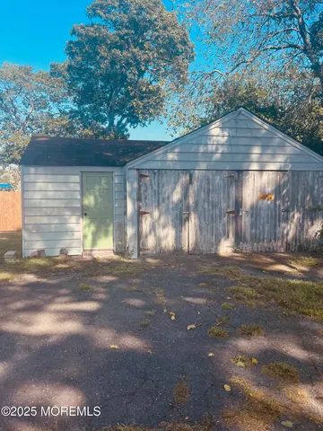 a view of a yard with a large tree