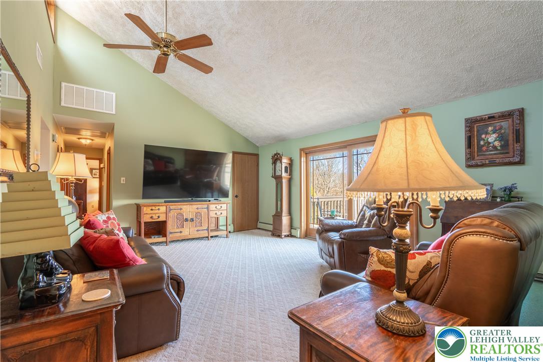 77 Uhlerstown Hill Road Erwinna, PA 18920 - Photo 12 of 47 a living room with furniture and a flat screen tv