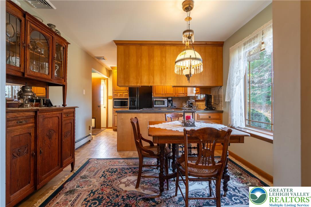 77 Uhlerstown Hill Road Erwinna, PA 18920 - Photo 13 of 47 a view of a dining room with furniture window and wooden floor