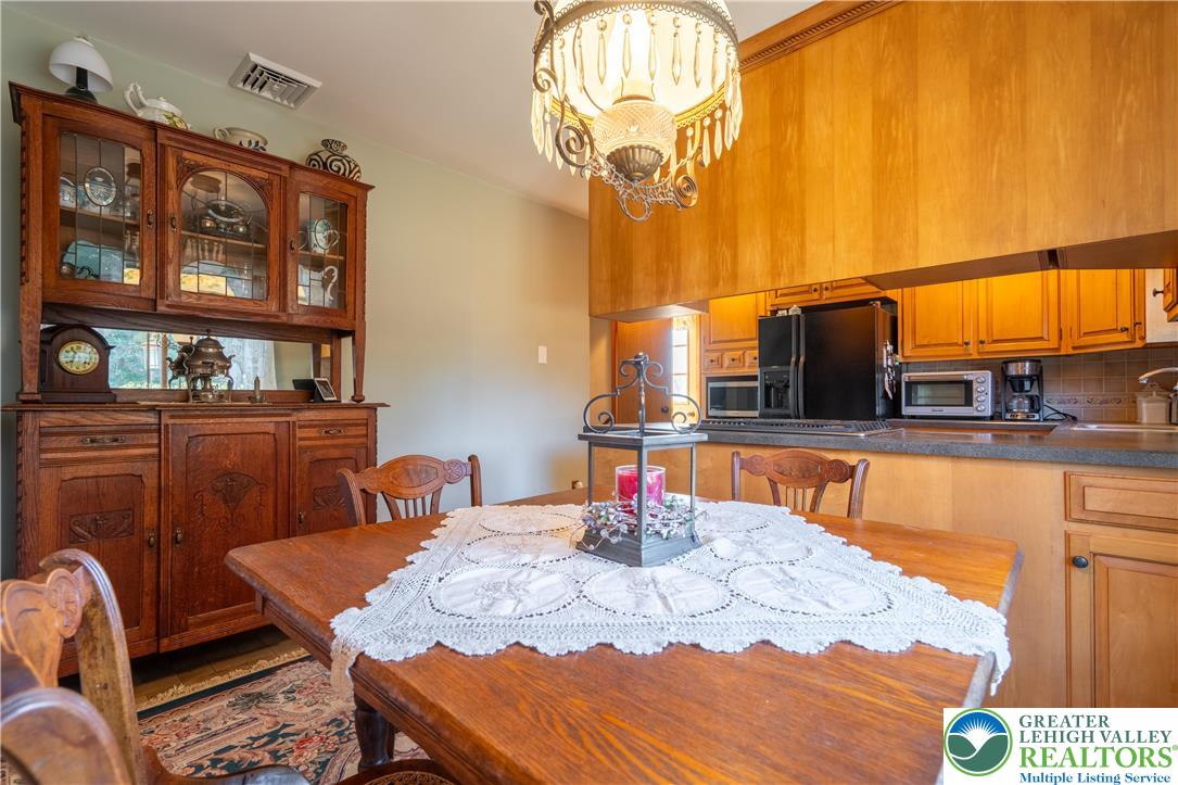 77 Uhlerstown Hill Road Erwinna, PA 18920 - Photo 15 of 47 a view of a dining room with furniture