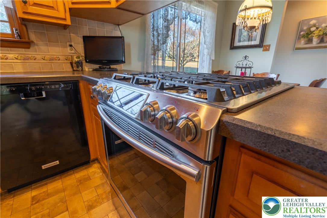 77 Uhlerstown Hill Road Erwinna, PA 18920 - Photo 16 of 47 a kitchen view of living room stove and a microwave