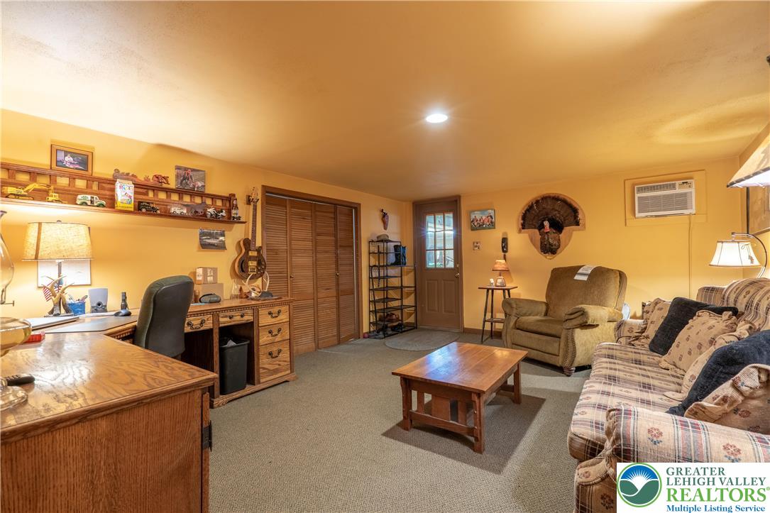 77 Uhlerstown Hill Road Erwinna, PA 18920 - Photo 26 of 47 a living room with furniture and a table