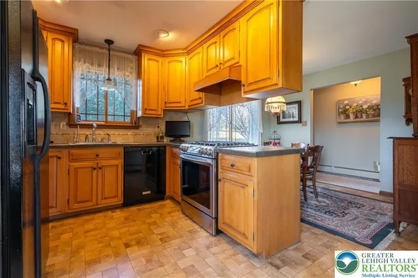 a view of a dining room with furniture wooden floor and chandelier