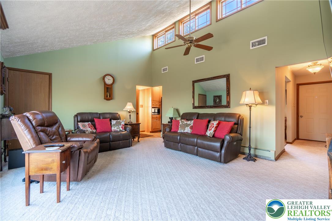77 Uhlerstown Hill Road Erwinna, PA 18920 - Photo 4 of 47 a living room with furniture and a wooden floor