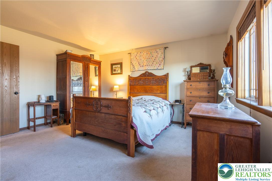 77 Uhlerstown Hill Road Erwinna, PA 18920 - Photo 5 of 47 a bedroom with a bed and a window