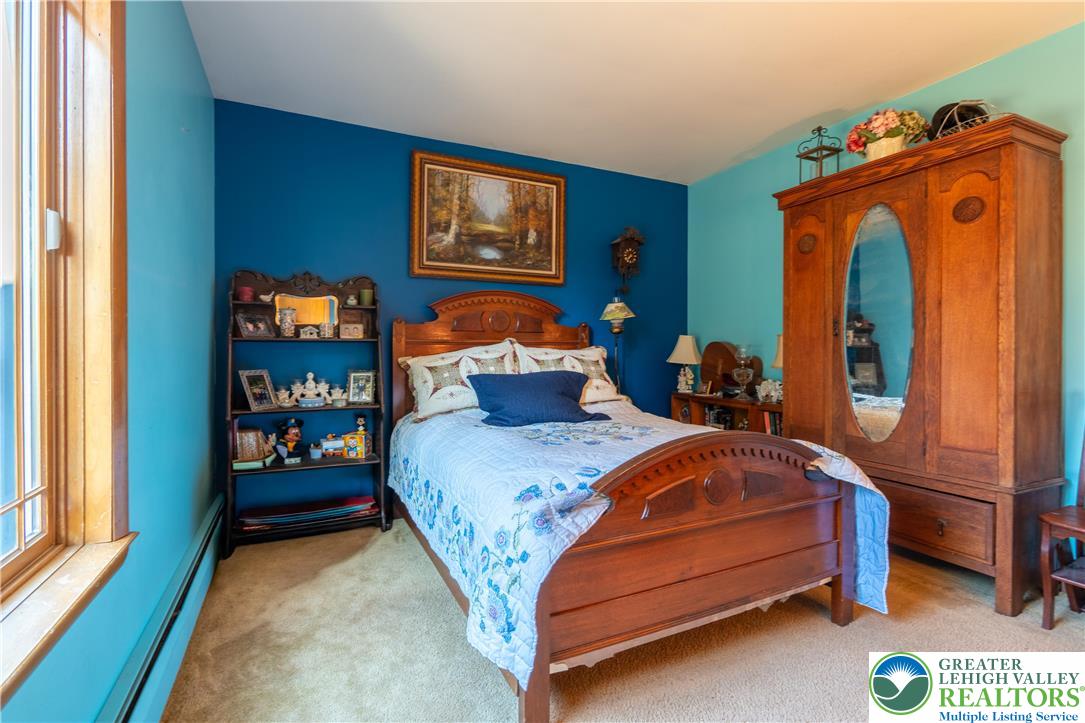 77 Uhlerstown Hill Road Erwinna, PA 18920 - Photo 6 of 47 a bedroom with bed and a window