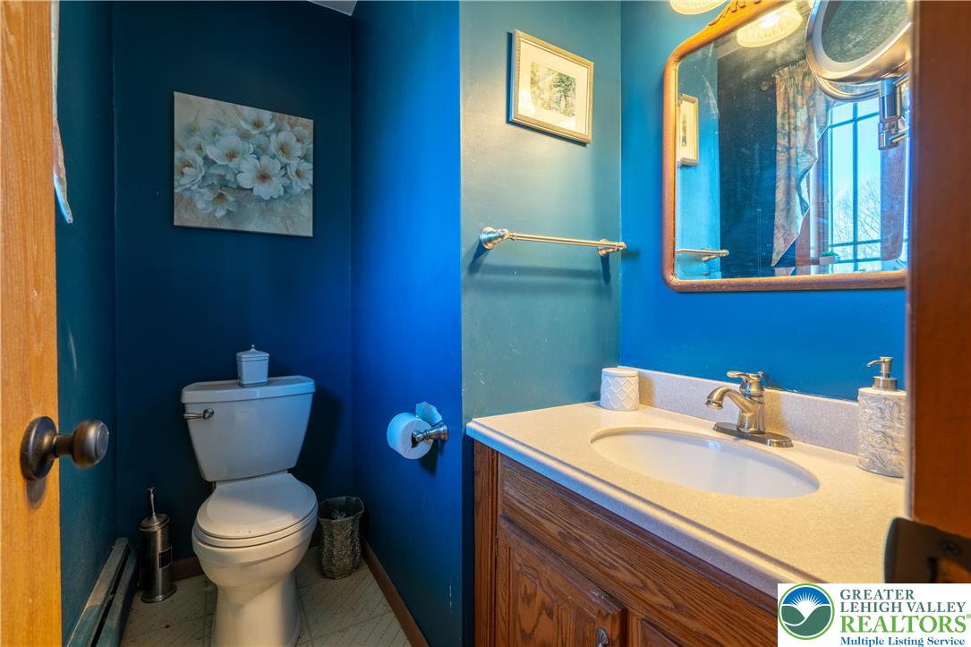 77 Uhlerstown Hill Road Erwinna, PA 18920 - Photo 8 of 47 a bathroom with a toilet sink and mirror