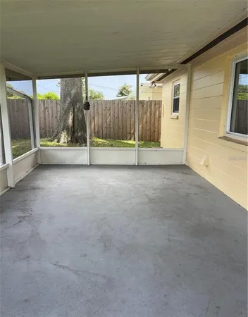 a view of an empty room with a balcony