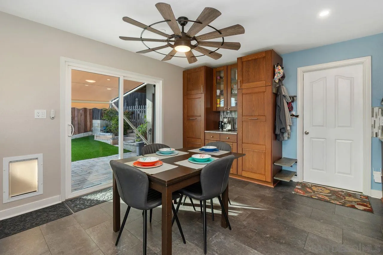 9545 Chestnut Street Spring Valley, CA 91977 - Photo 11 of 32 a outdoor dining space with furniture and chandelier