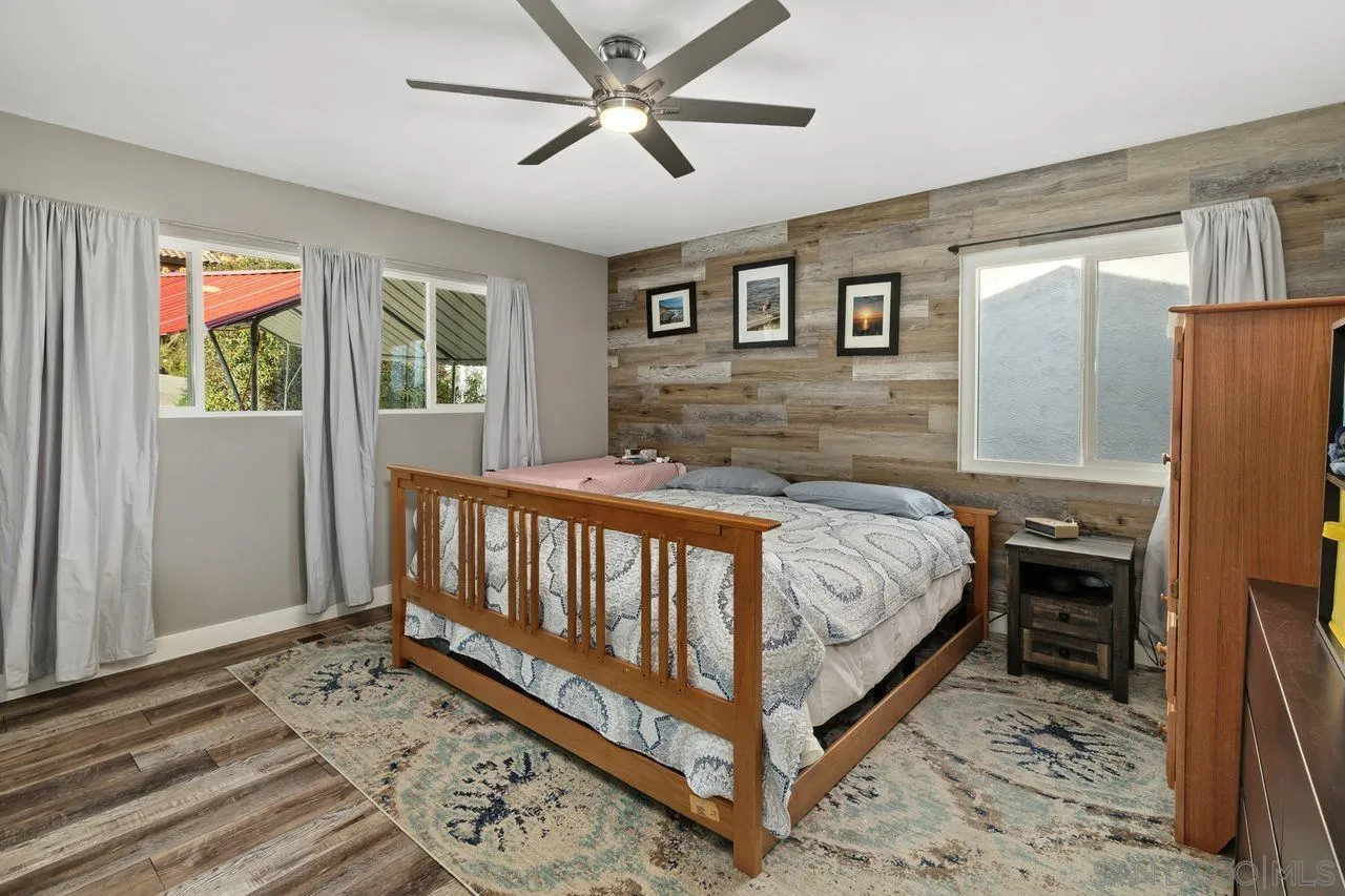 9545 Chestnut Street Spring Valley, CA 91977 - Photo 15 of 32 a bed sitting in a spacious bedroom next to a window