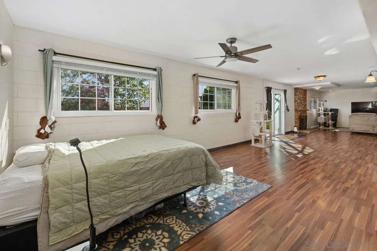 9545 Chestnut Street Spring Valley, CA 91977 - Photo 20 of 32 a bed sitting in a spacious bedroom next to a window