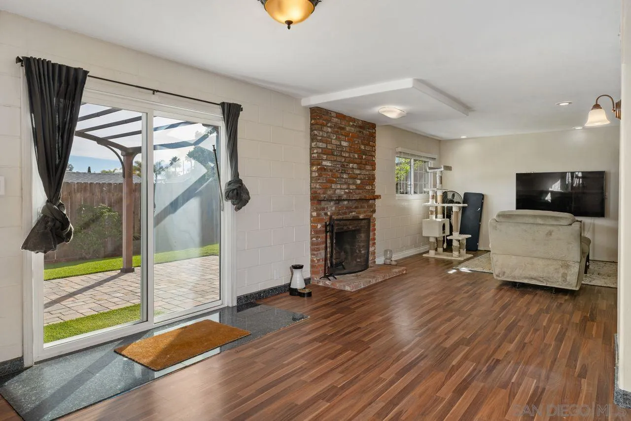 9545 Chestnut Street Spring Valley, CA 91977 - Photo 21 of 32 a view of a livingroom with furniture and a flat screen tv