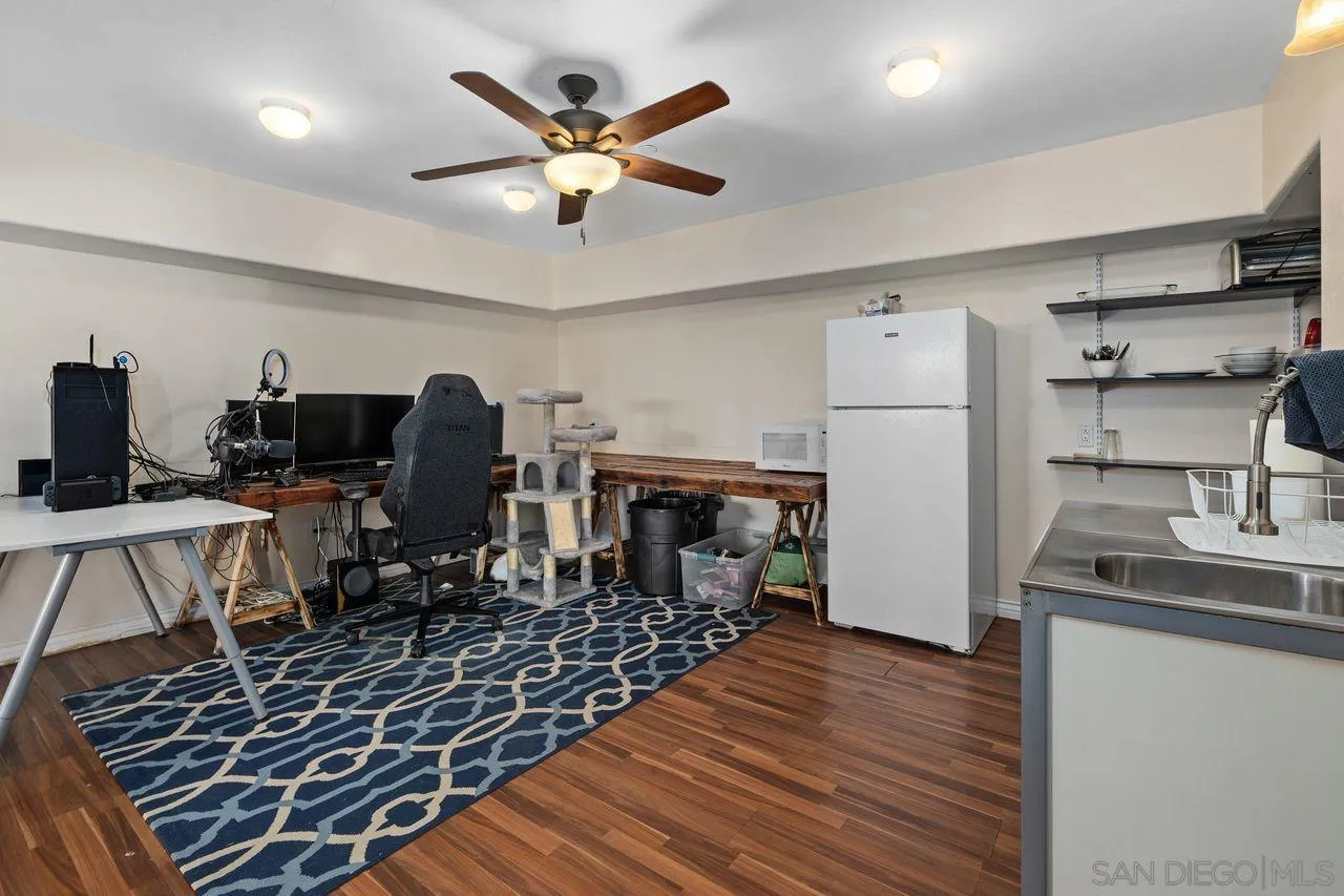 9545 Chestnut Street Spring Valley, CA 91977 - Photo 24 of 32 a view of a dining room with furniture and wooden floor