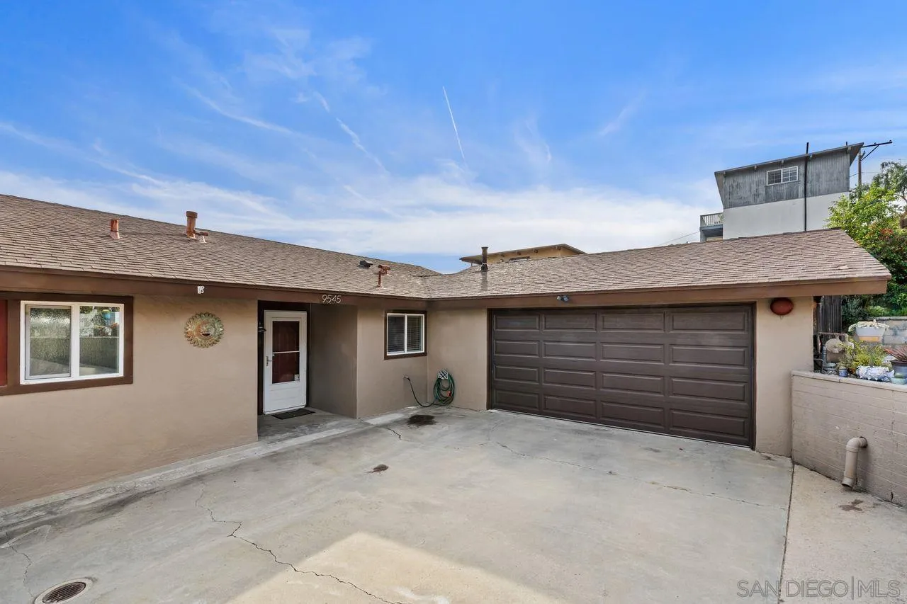 9545 Chestnut Street Spring Valley, CA 91977 - Photo 4 of 32 a view of a house with a garage