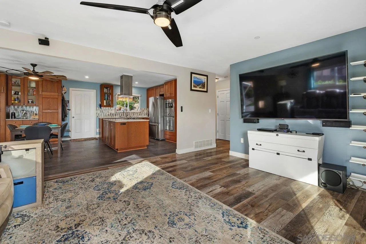 9545 Chestnut Street Spring Valley, CA 91977 - Photo 8 of 32 a living room with furniture and a flat screen tv