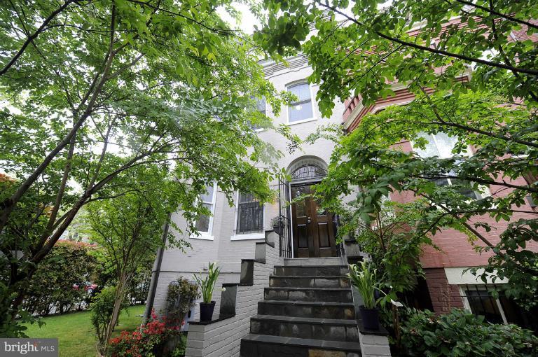 1219 Q Street Northwest Washington, DC 20009 - Photo 1 of 25 a view of a house with a tree