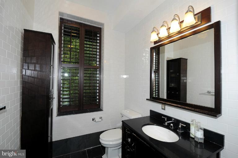 1219 Q Street Northwest Washington, DC 20009 - Photo 18 of 25 a bathroom with a sink a toilet and shower