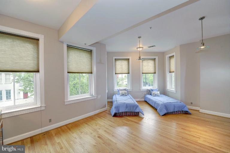 1219 Q Street Northwest Washington, DC 20009 - Photo 23 of 25 a living room with couch and a window