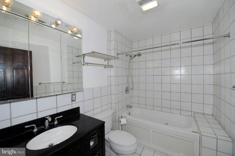 1219 Q Street Northwest Washington, DC 20009 - Photo 9 of 25 a bathroom with a sink a toilet and shower