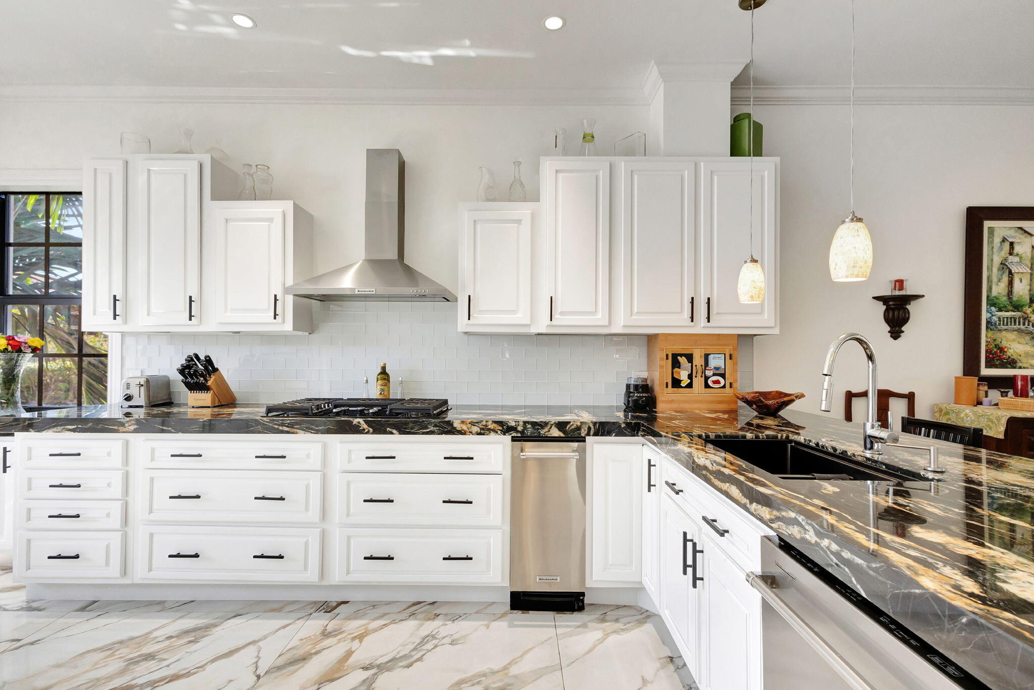 301 Del Sol Circle Tequesta, FL 33469 - Photo 13 of 83 a kitchen with granite countertop a sink and cabinets