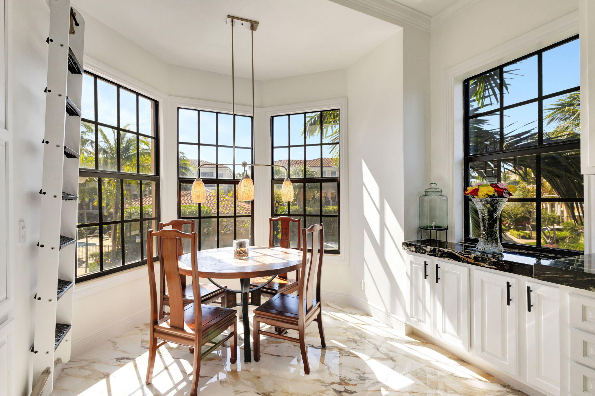 301 Del Sol Circle Tequesta, FL 33469 - Photo 15 of 83 a view of a dining room with furniture window and outside view