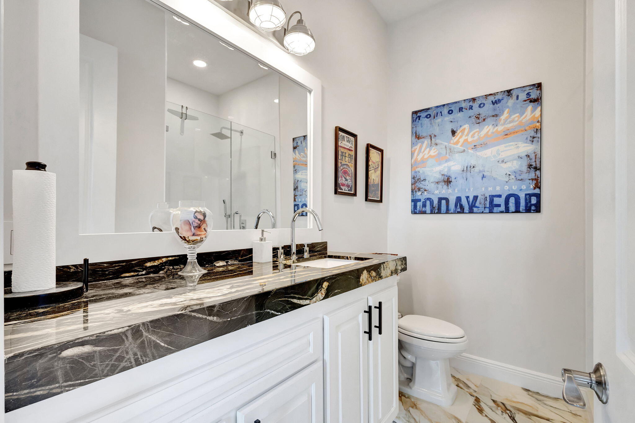 301 Del Sol Circle Tequesta, FL 33469 - Photo 41 of 83 a bathroom with a granite countertop sink mirror vanity and toilet