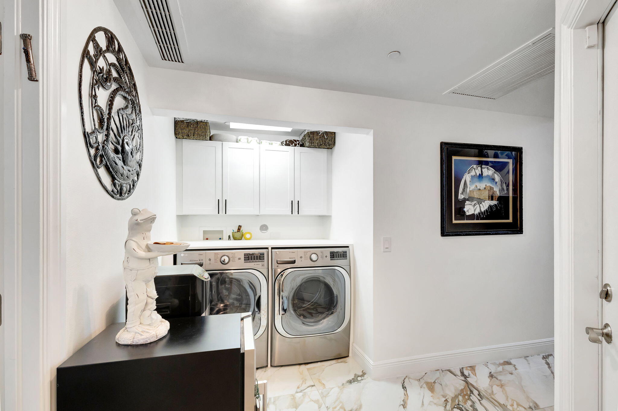 301 Del Sol Circle Tequesta, FL 33469 - Photo 44 of 83 a utility room with sink dryer and washer