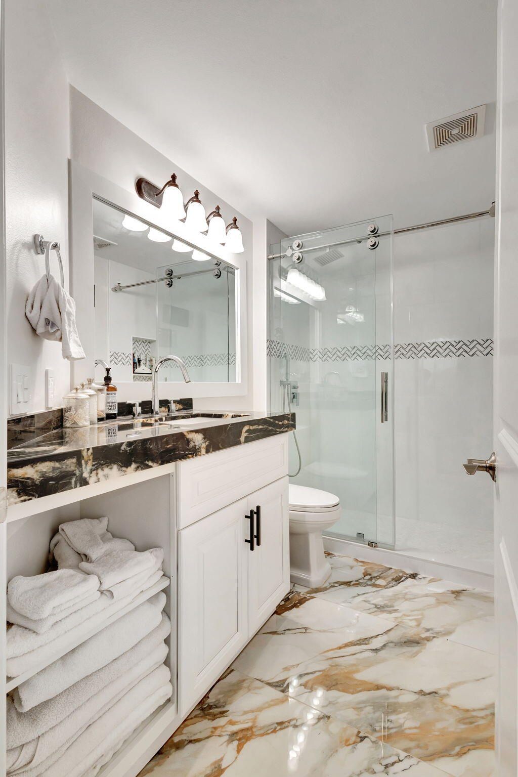 301 Del Sol Circle Tequesta, FL 33469 - Photo 46 of 83 a bathroom with a double vanity sink mirror and toilet