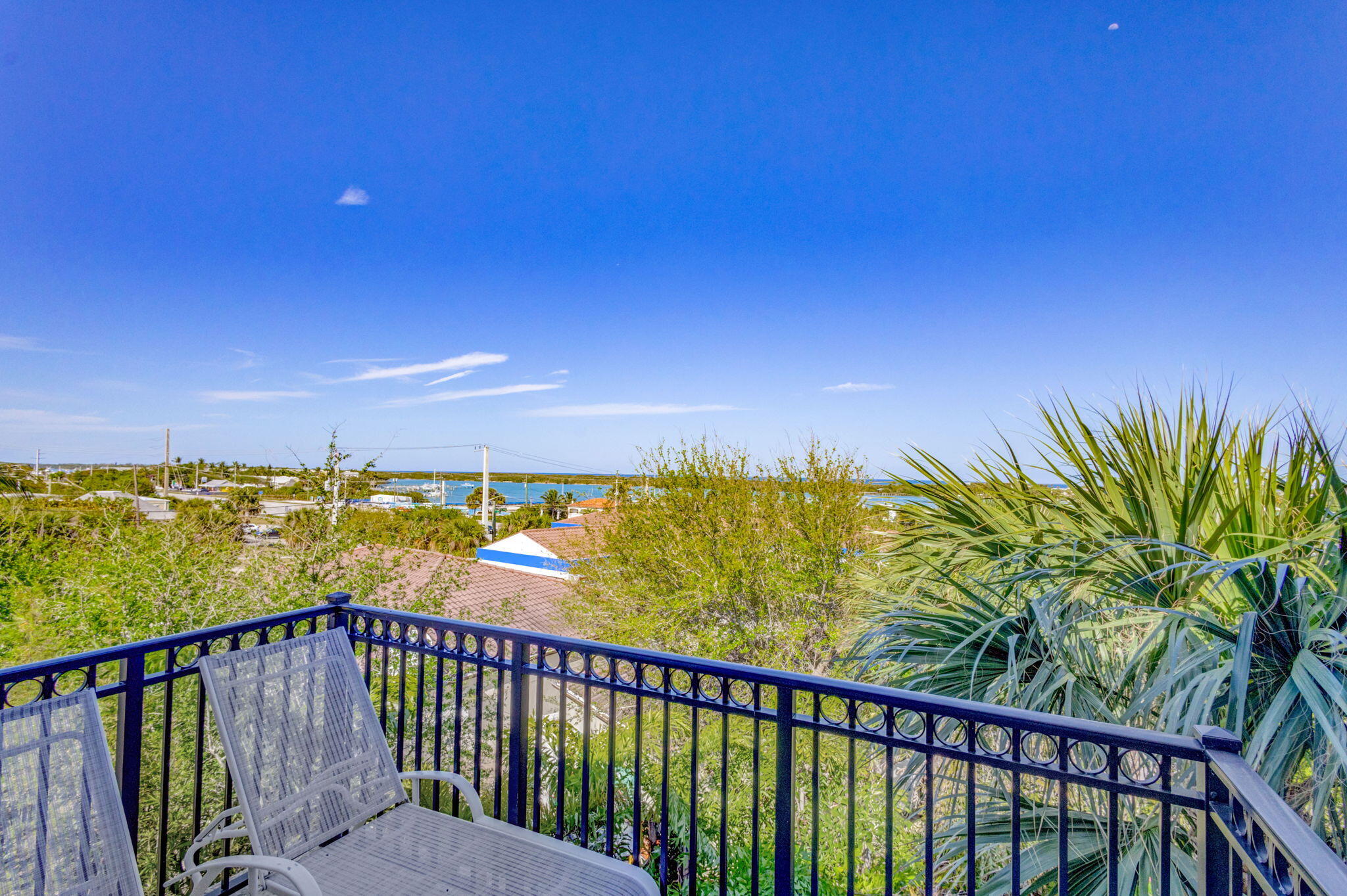 301 Del Sol Circle Tequesta, FL 33469 - Photo 55 of 83 a view of a balcony with an outdoor space and seating