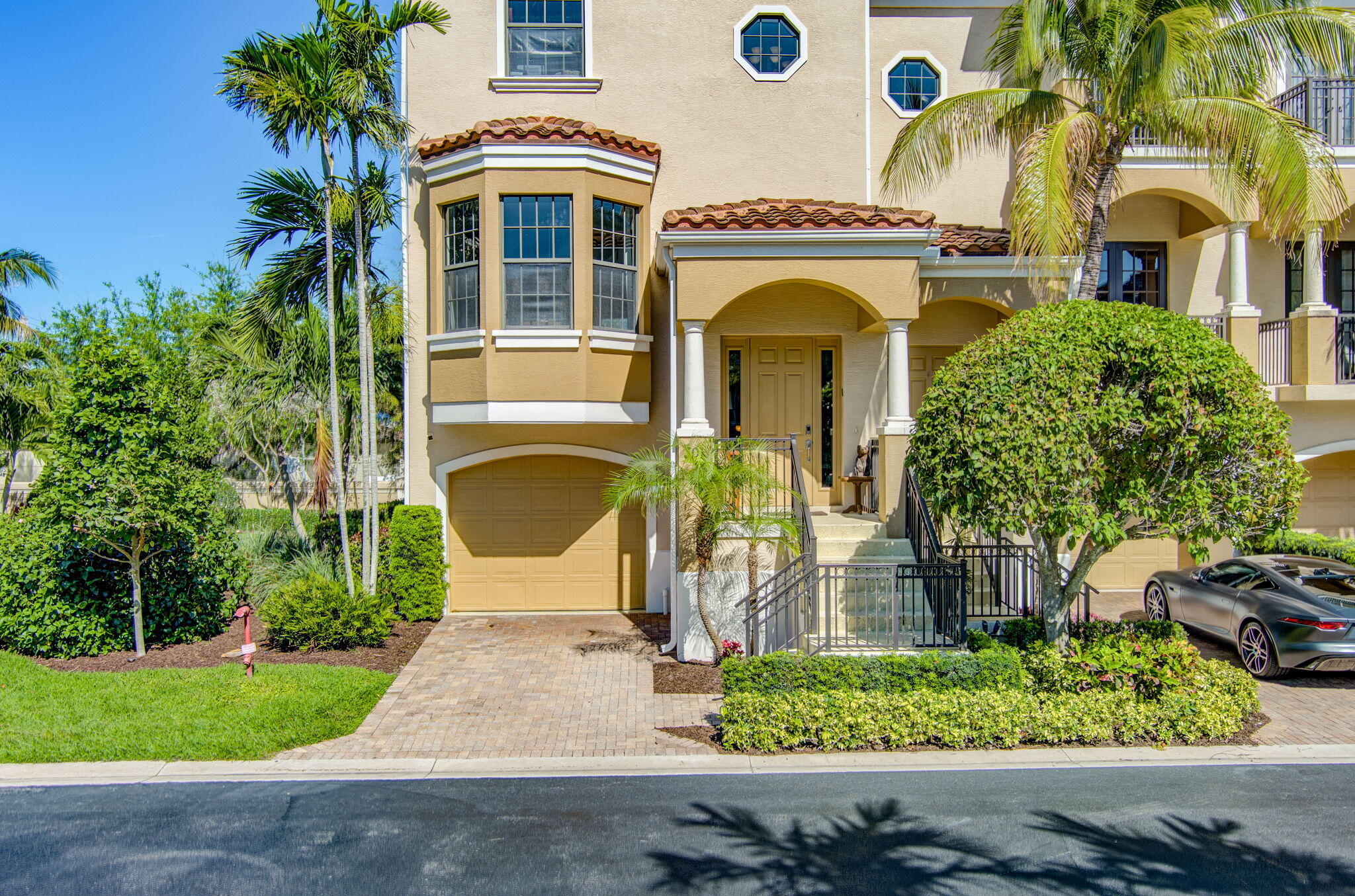 301 Del Sol Circle Tequesta, FL 33469 - Photo 61 of 83 a front view of a house with a garden