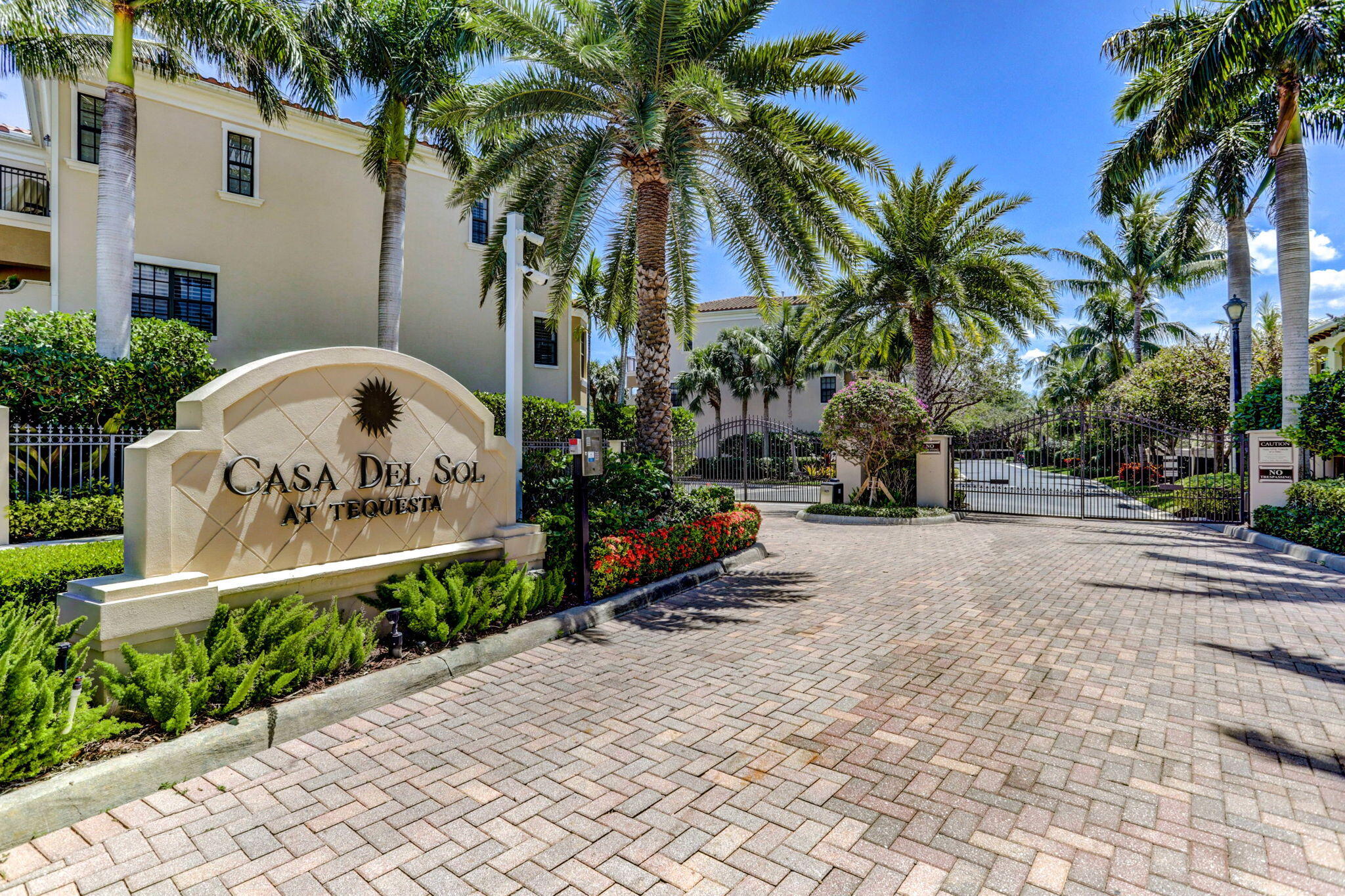 301 Del Sol Circle Tequesta, FL 33469 - Photo 83 of 83 a front view of multi story residential apartment building with yard and sign board