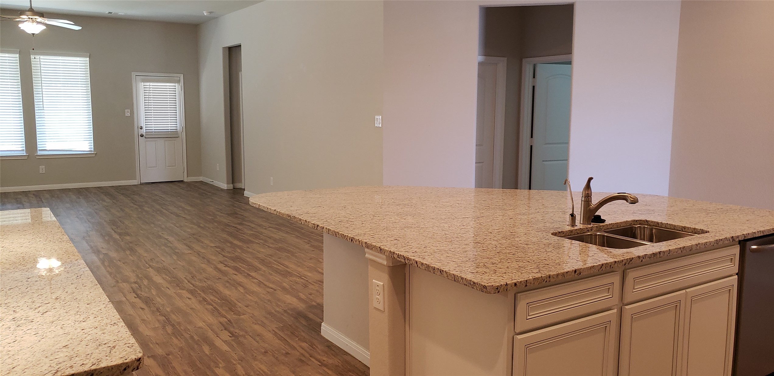 6206 Blue Coast Lane Conroe, TX 77304 - Photo 11 of 43 a kitchen with a sink and cabinets