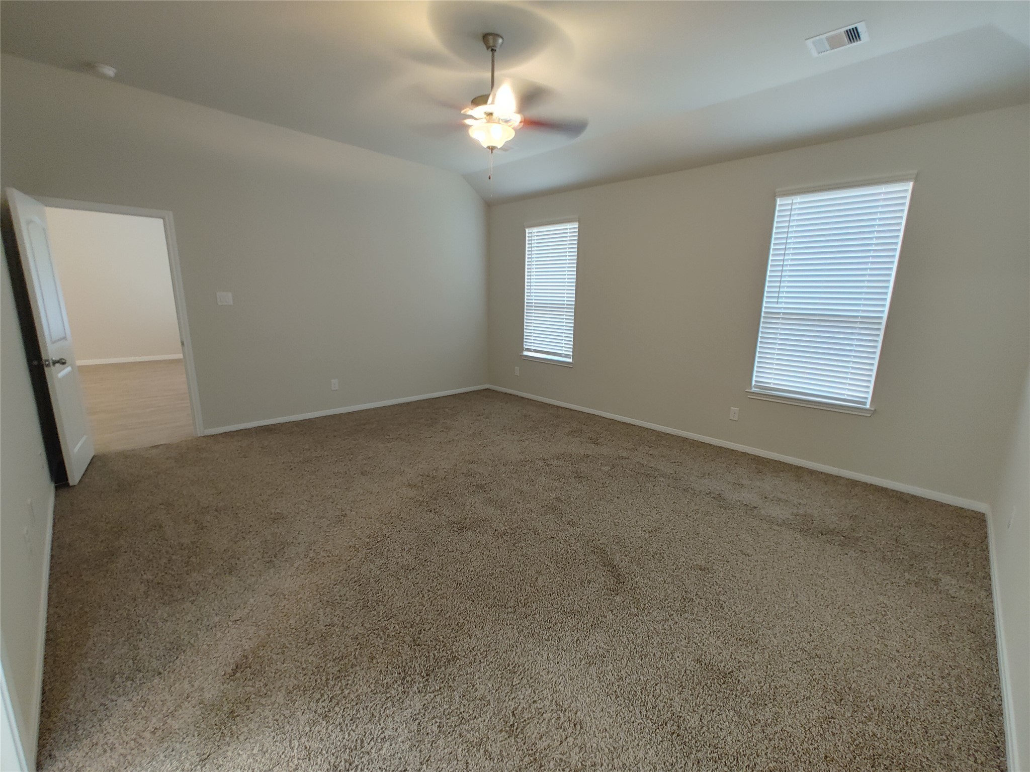 6206 Blue Coast Lane Conroe, TX 77304 - Photo 15 of 43 an empty room with windows and fan