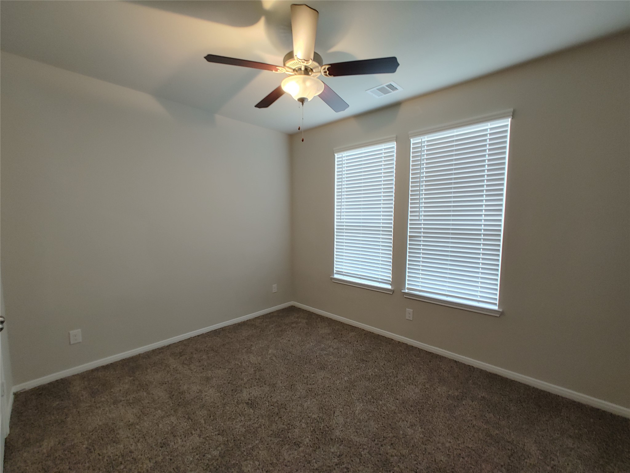 6206 Blue Coast Lane Conroe, TX 77304 - Photo 17 of 43 an empty room with windows and fan