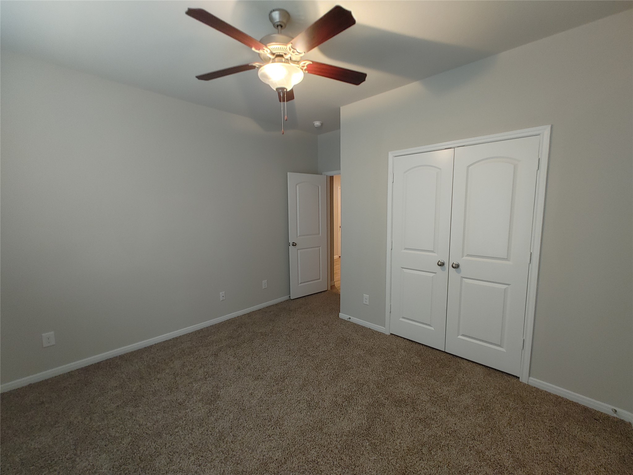 6206 Blue Coast Lane Conroe, TX 77304 - Photo 22 of 43 an empty room with a fan & a ceiling fan