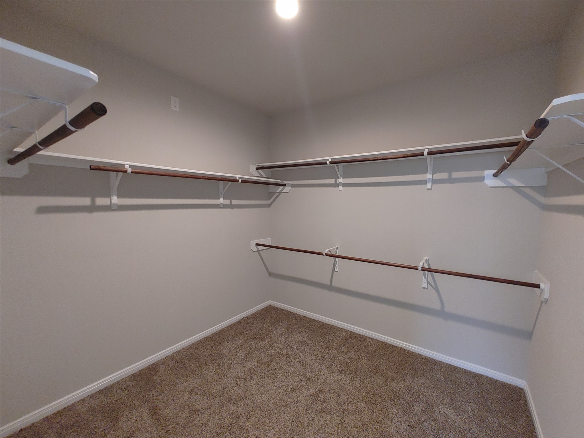 6206 Blue Coast Lane Conroe, TX 77304 - Photo 23 of 43 a view of a room with racks on the wall