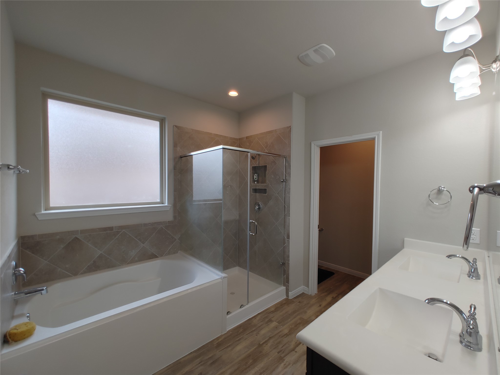 6206 Blue Coast Lane Conroe, TX 77304 - Photo 24 of 43 a bathroom with a tub sink and mirror