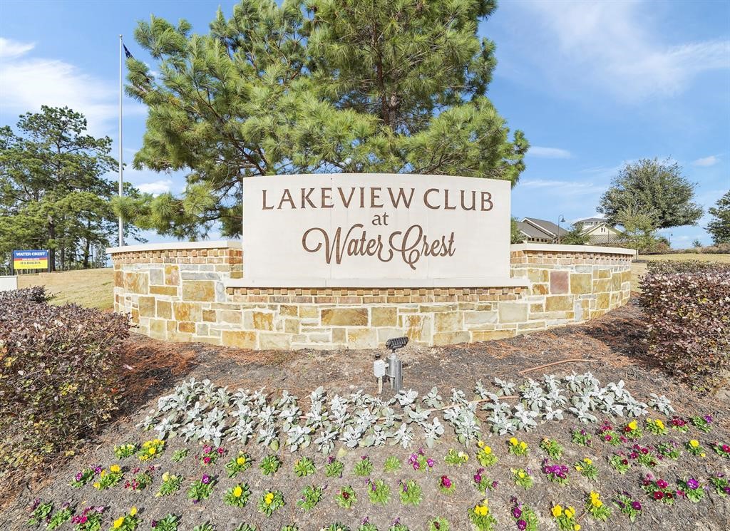 6206 Blue Coast Lane Conroe, TX 77304 - Photo 37 of 43 a sign on the side of the road