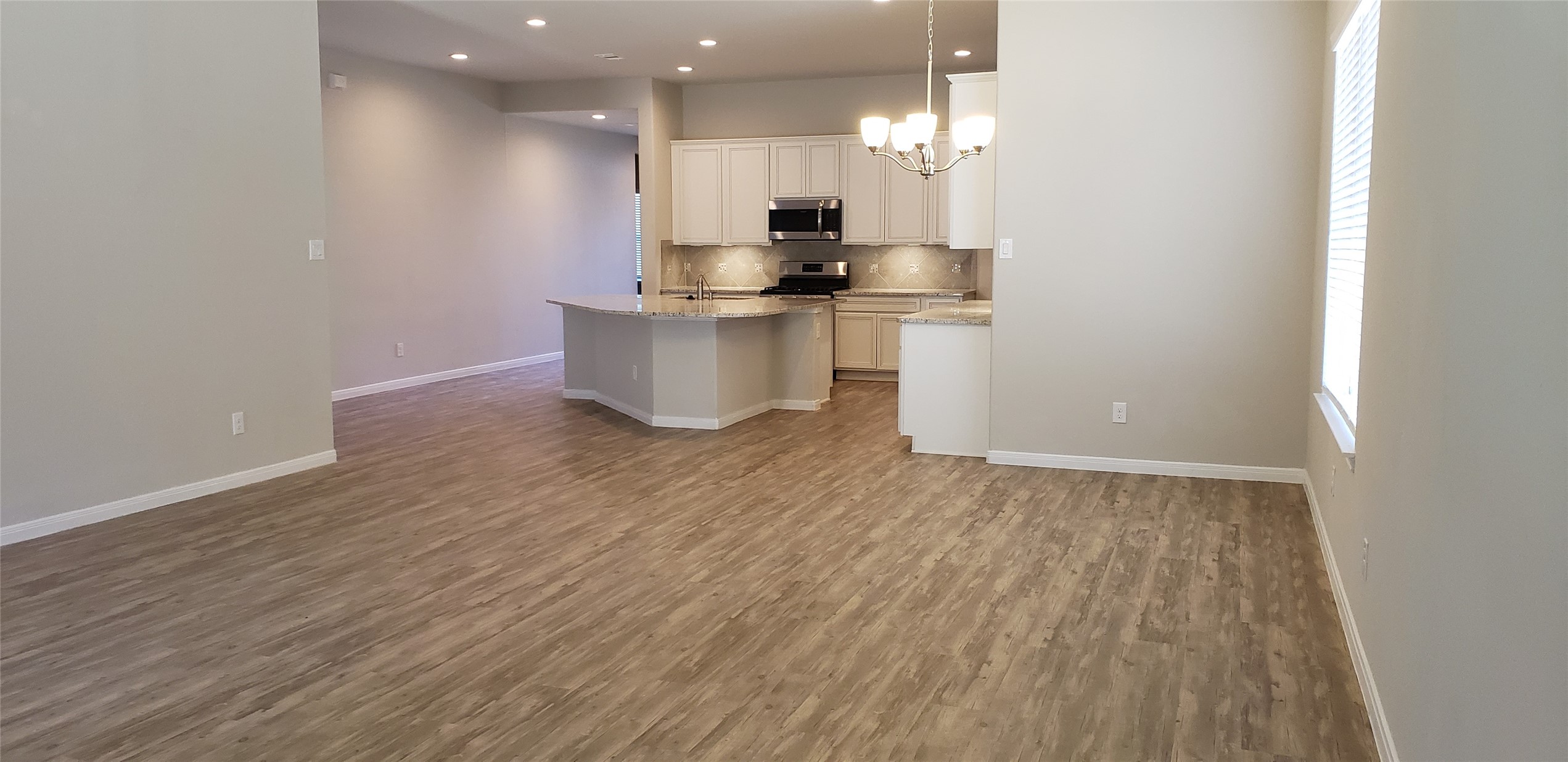 6206 Blue Coast Lane Conroe, TX 77304 - Photo 8 of 43 a view of kitchen with wooden floor and electronic appliances