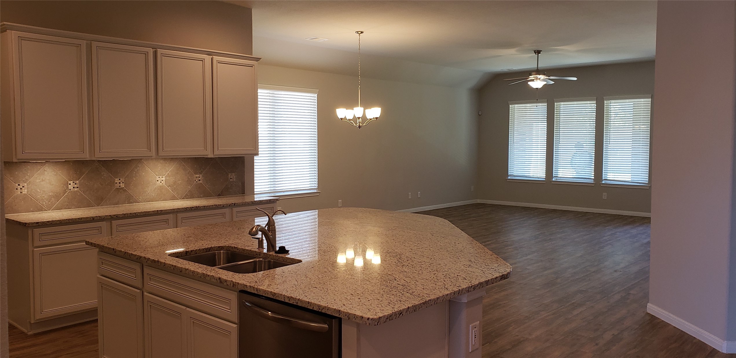 6206 Blue Coast Lane Conroe, TX 77304 - Photo 9 of 43 a kitchen with a sink cabinets and window